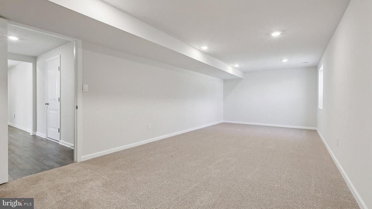 120 Winding Road Easton, PA 18040 - Photo 78 of 80 an empty room with wooden floor and windows
