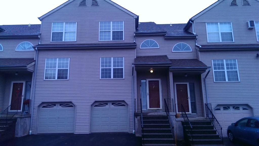 34 Taft Pointe, Unit 78 Waterbury, CT 06708 - Photo 1 of 1 a view of a house with a door and a large window
