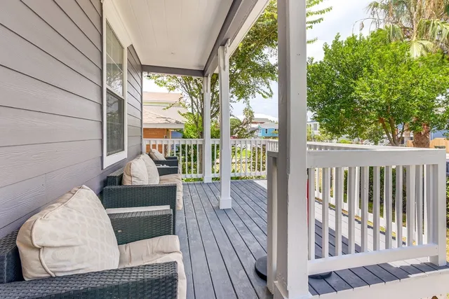 a view of balcony with wooden floor
