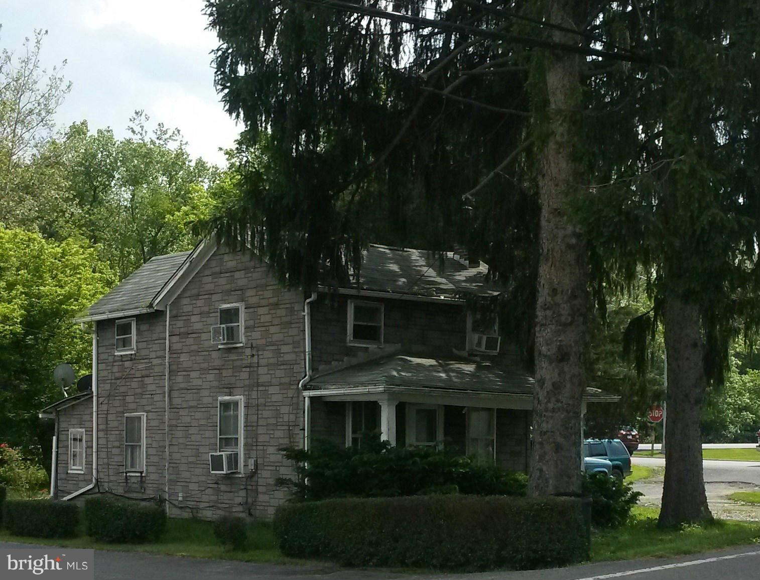 10710 Kreighbaum Road Corriganville, MD 21502 - Photo 2 of 4 a front view of a house with a garden
