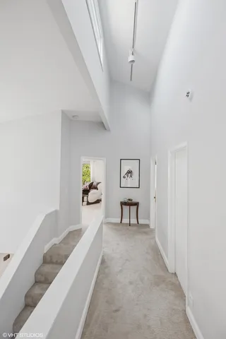 a view of a bedroom with furniture and window