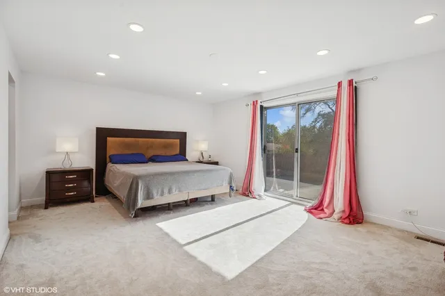 a bedroom with a bed and a view of bedroom