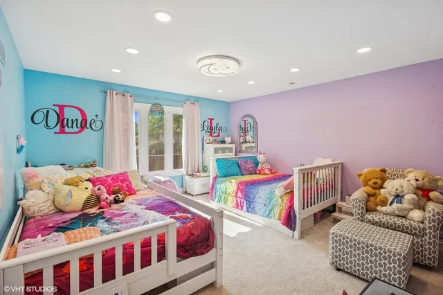 a bedroom with furniture and a book shelf