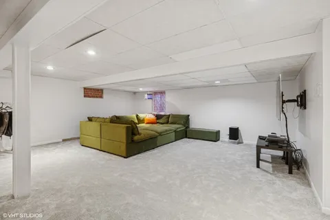 a livingroom with furniture and white walls