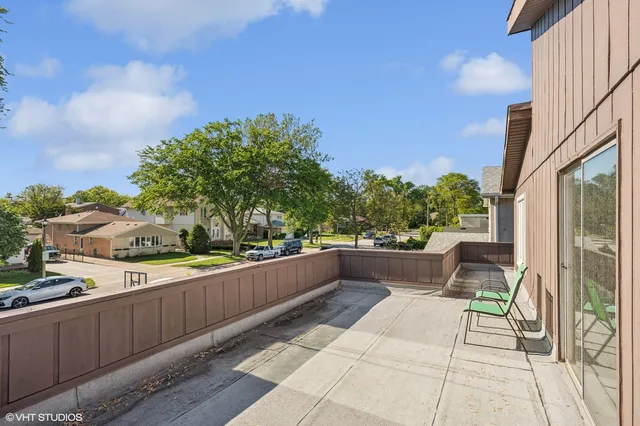 a view of balcony with furniture