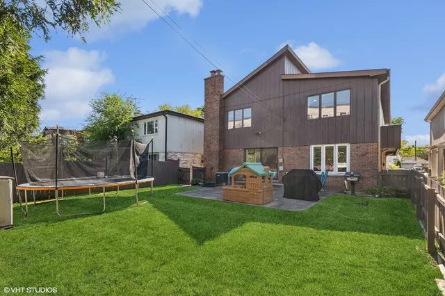a front view of house with yard and outdoor seating