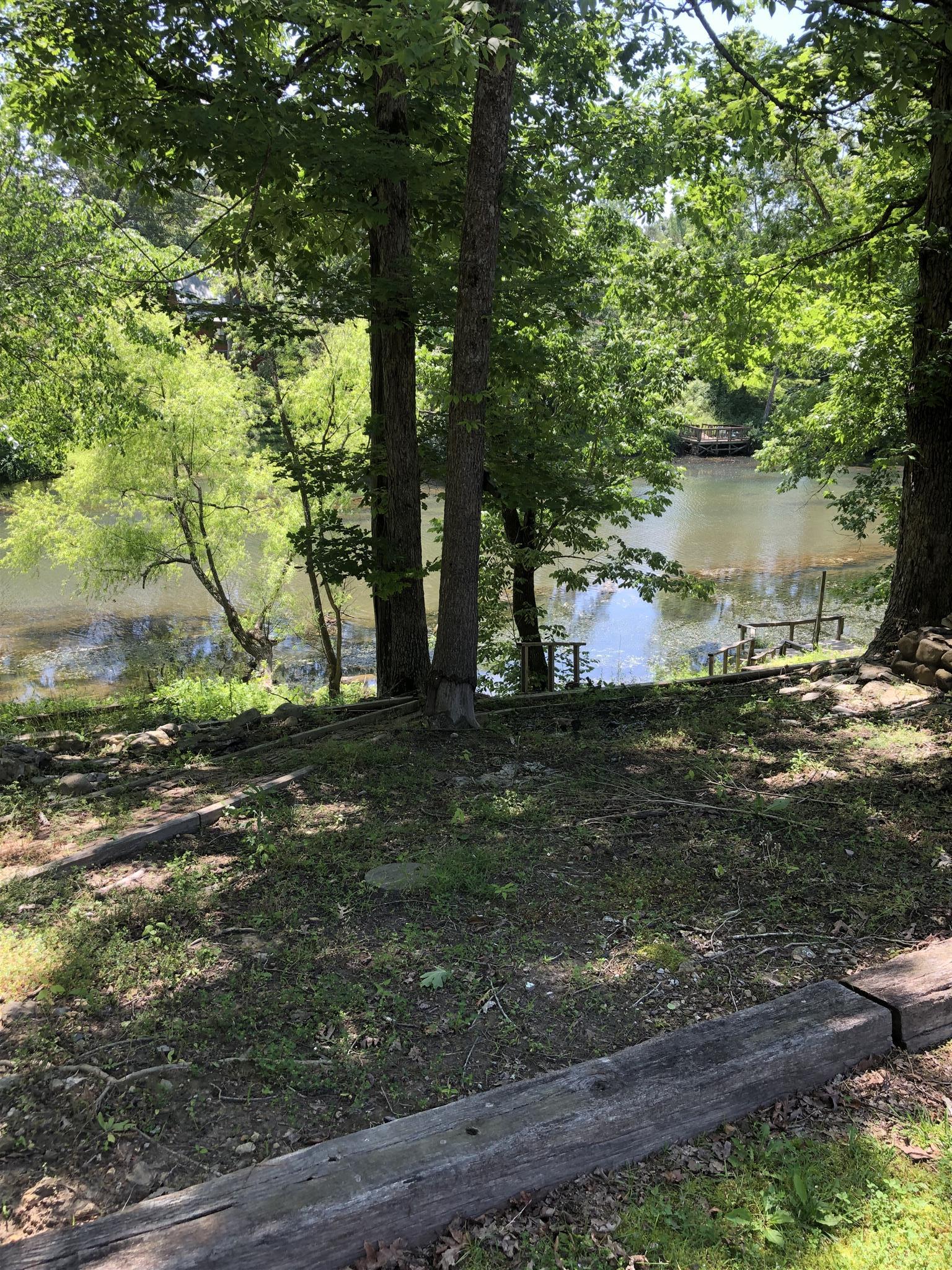 112 Fredonia Road Manchester, TN 37355 - Photo 7 of 8 Your back yard offers an inviting view of the river! Sit down and relax awhile!!