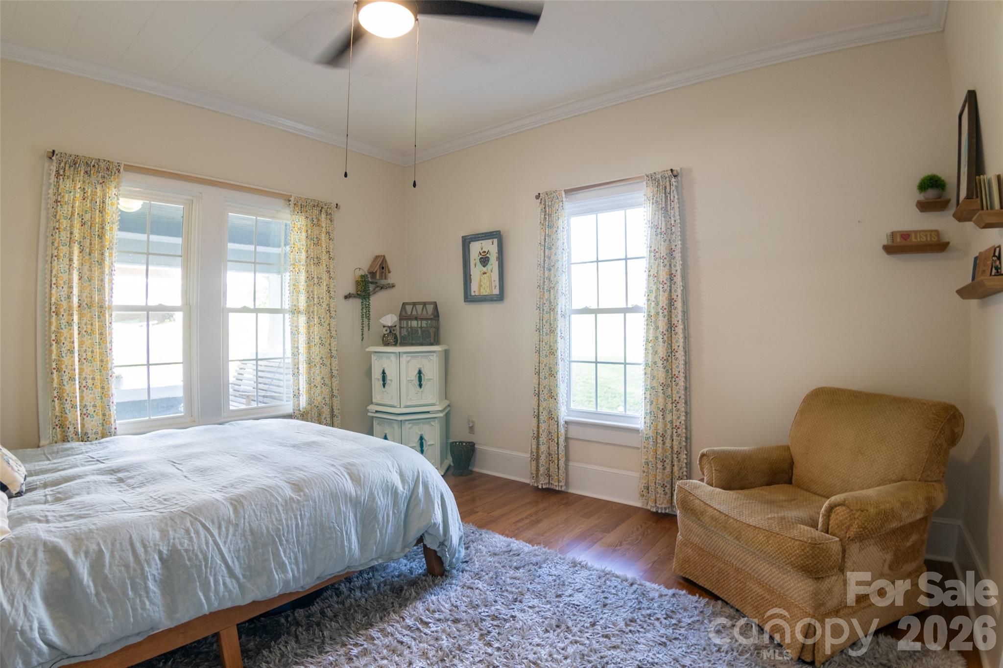 102 Cuthberson Street Morganton, NC 28655 - Photo 23 of 45 a spacious bedroom with a bed and a couch