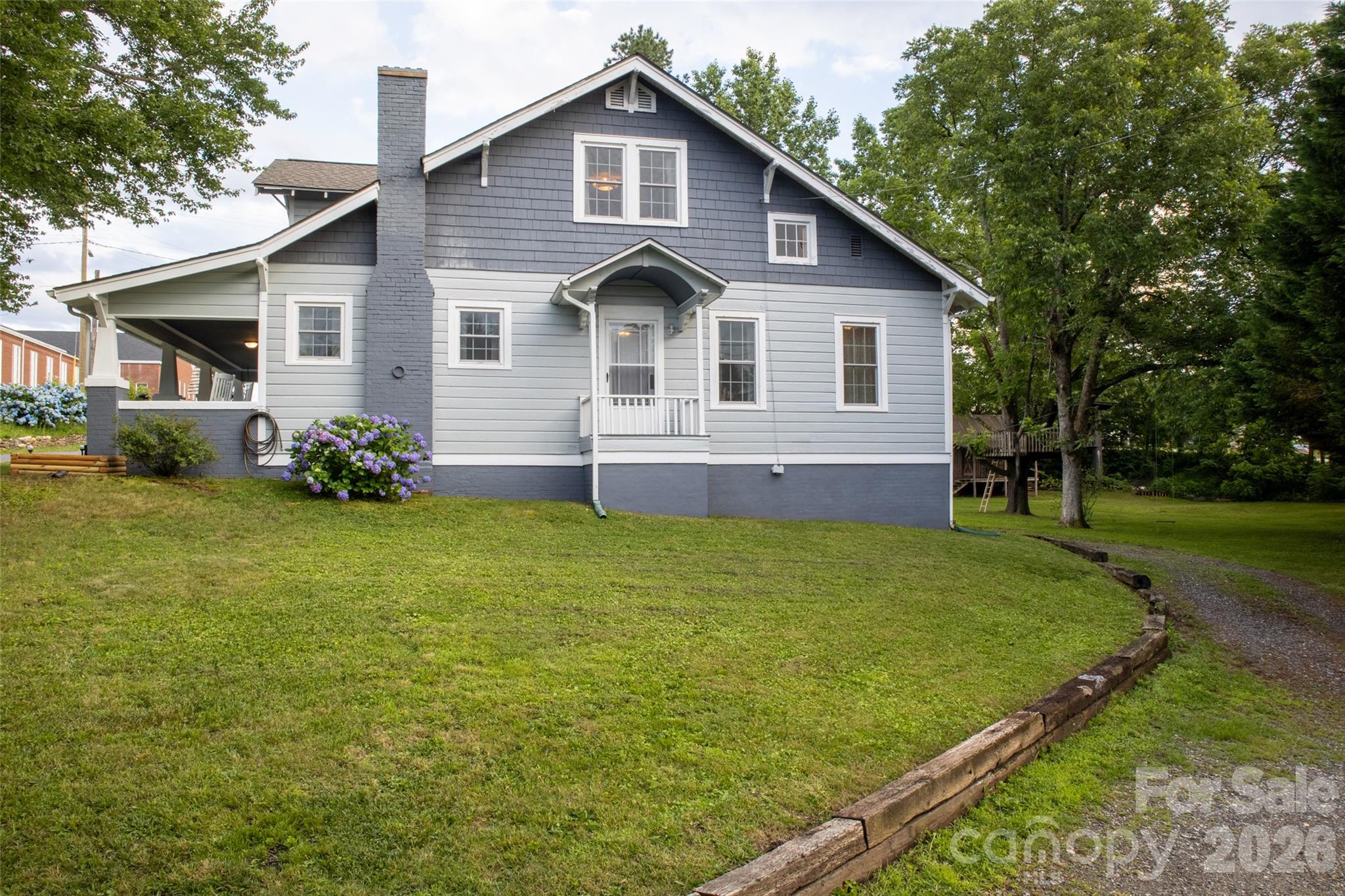 102 Cuthberson Street Morganton, NC 28655 - Photo 40 of 45 a view of a house with a yard and sitting area