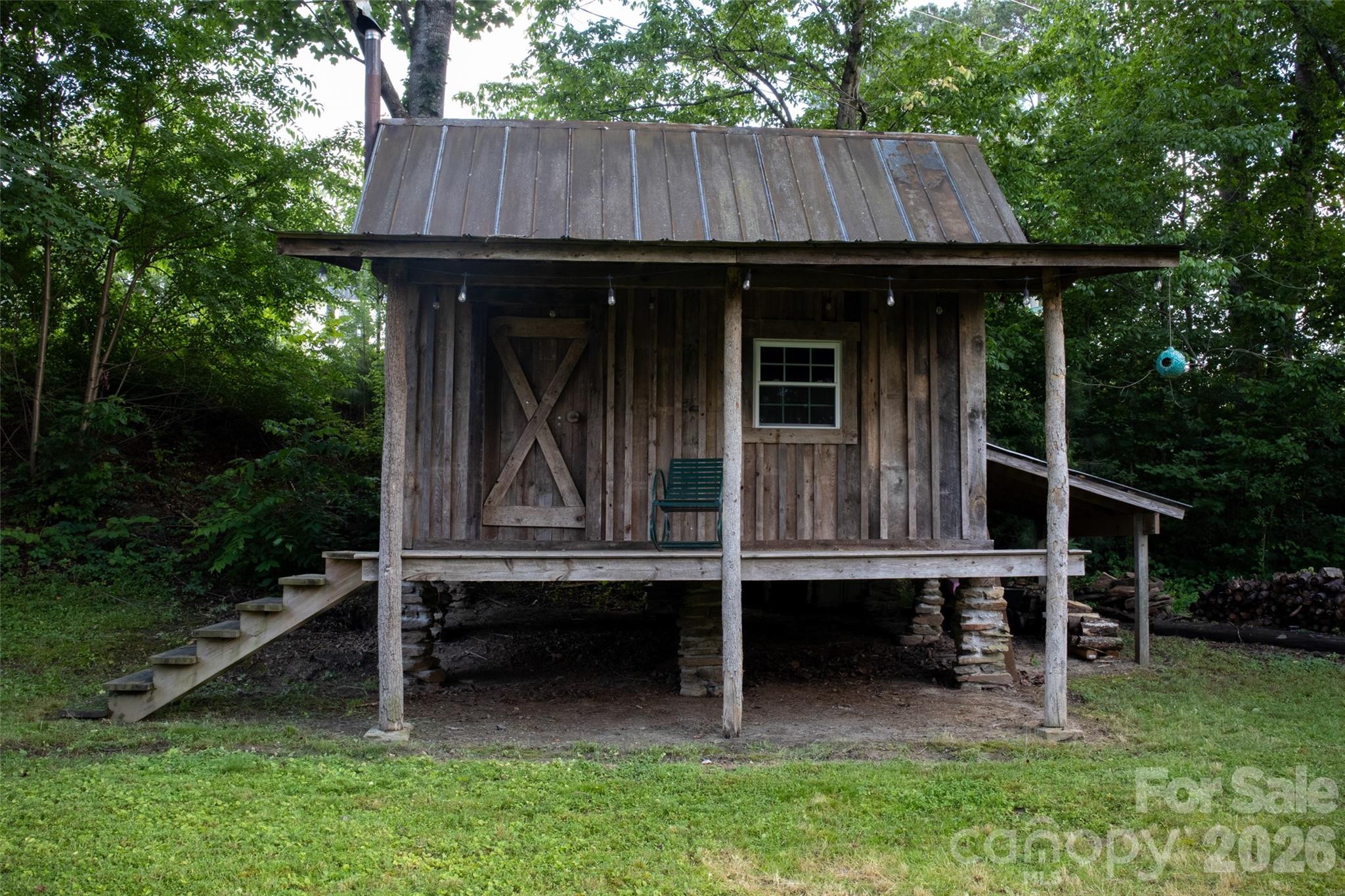 102 Cuthberson Street Morganton, NC 28655 - Photo 43 of 45 a view of wooden house with a small yard and wooden fence