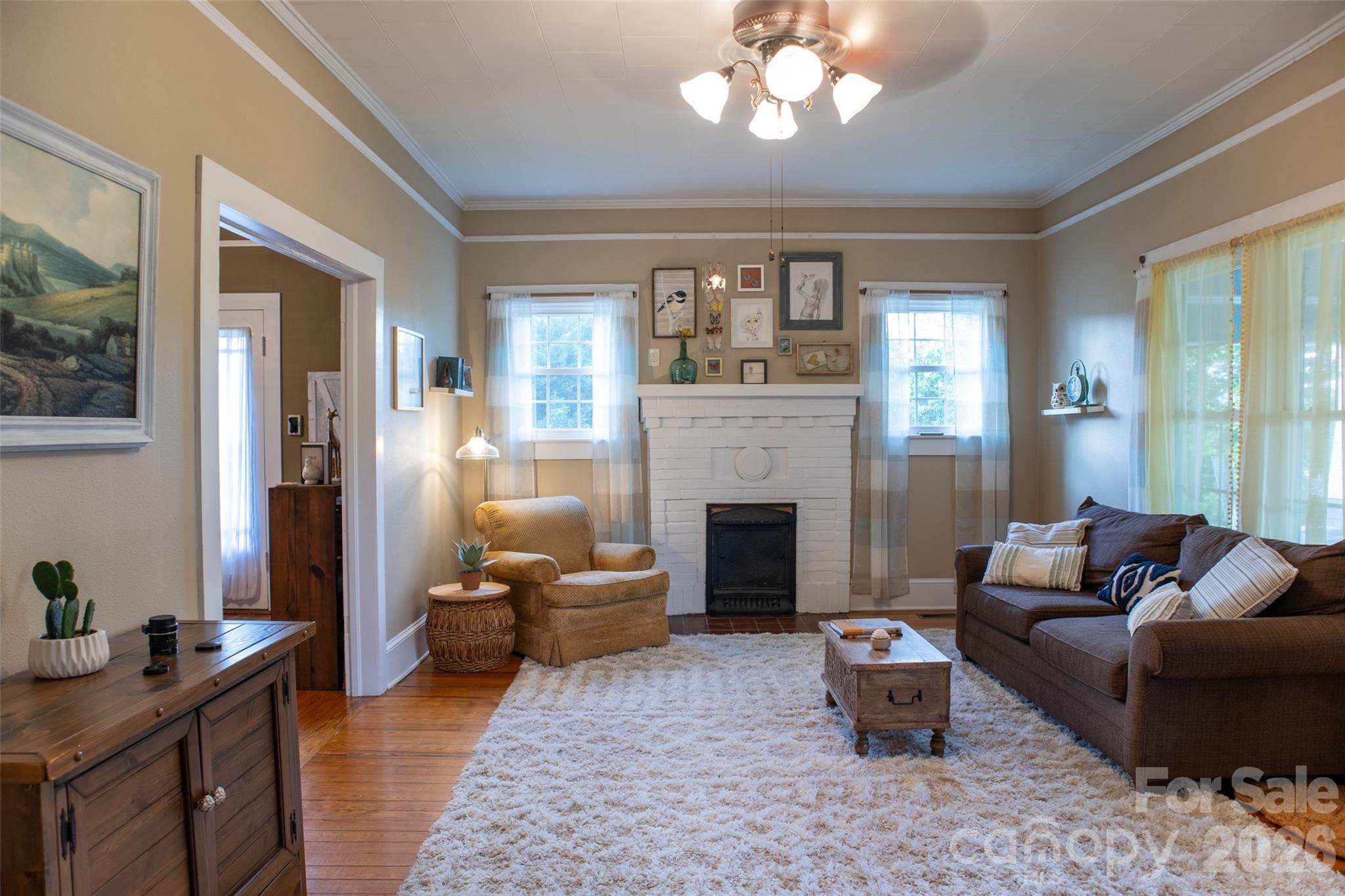 102 Cuthberson Street Morganton, NC 28655 - Photo 7 of 45 a living room with furniture and a fireplace