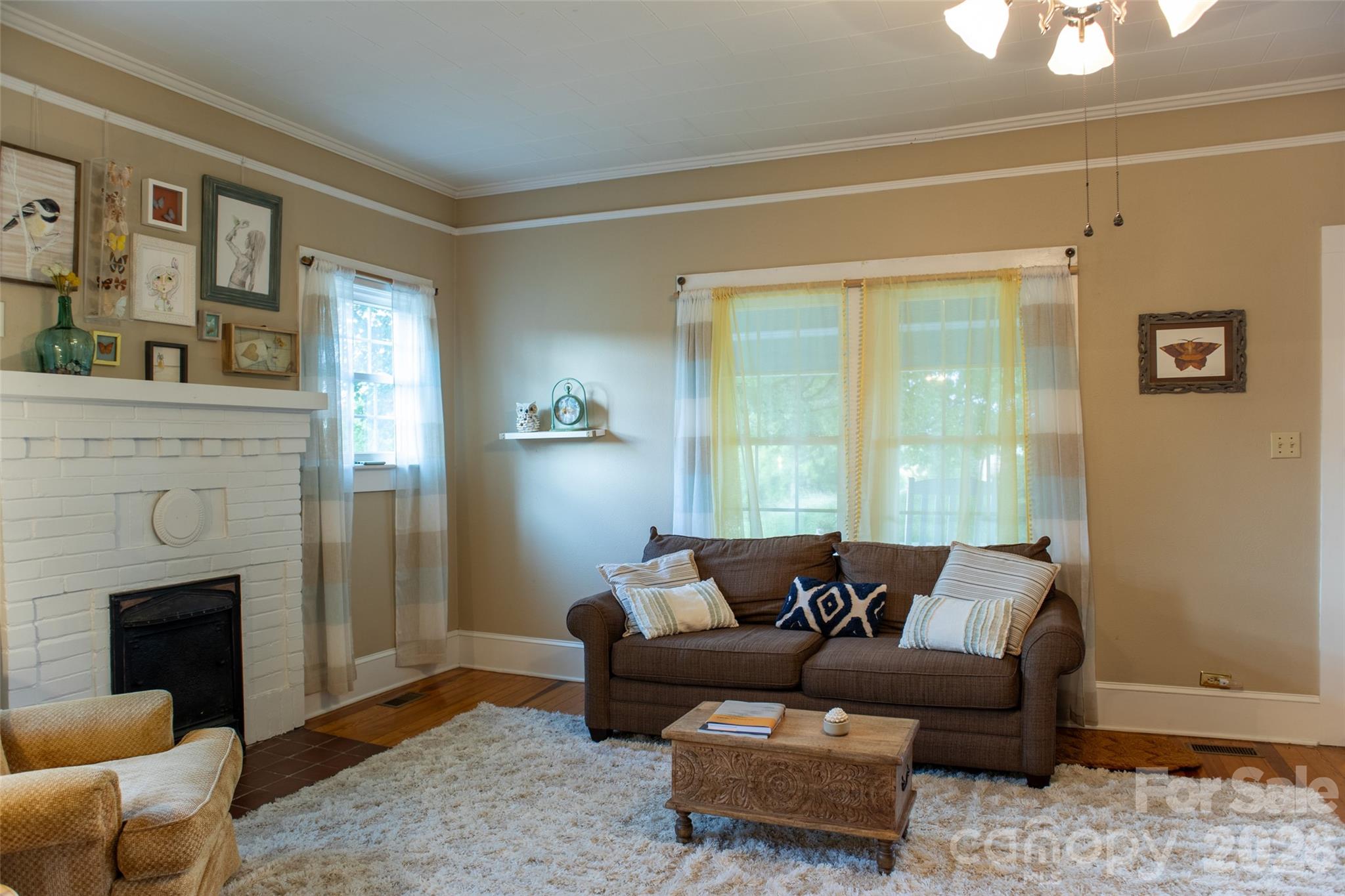 102 Cuthberson Street Morganton, NC 28655 - Photo 8 of 45 a living room with furniture and a fireplace