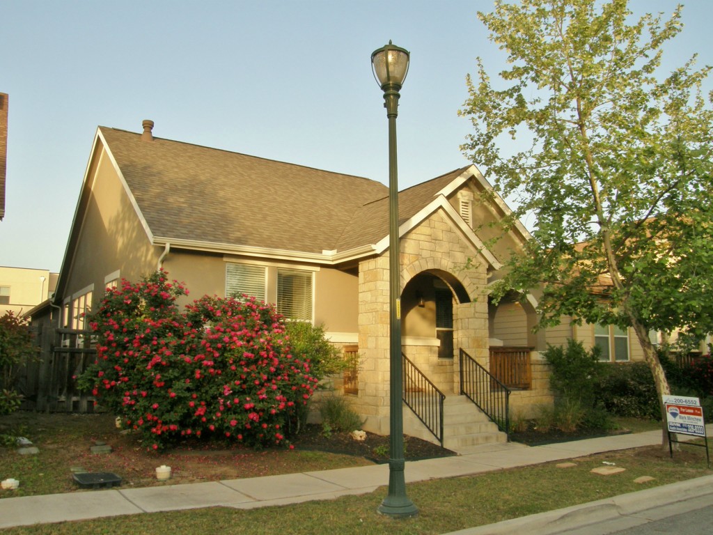 a house view with a garden space