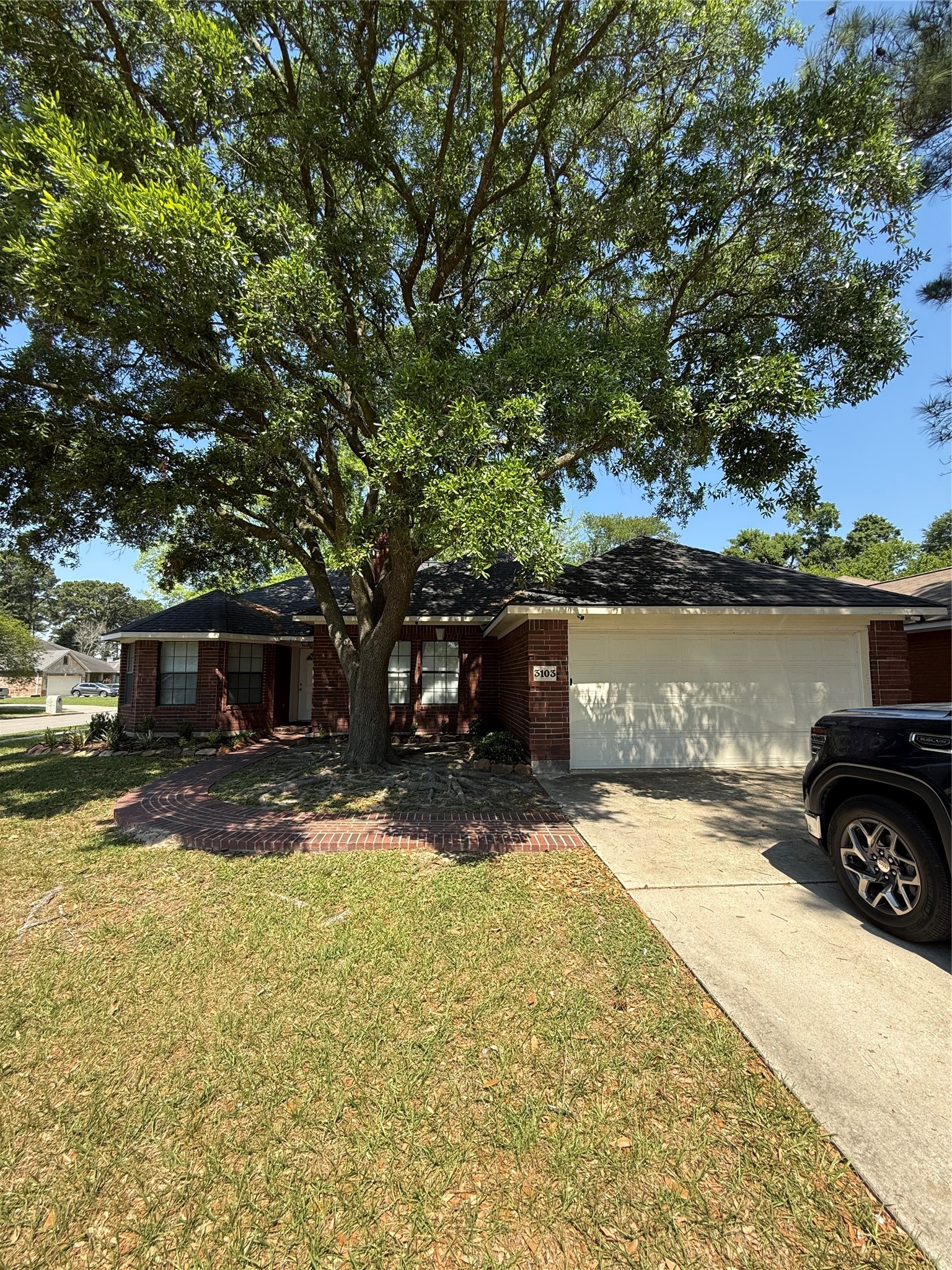 3103 Pine Dust Lane Spring, TX 77373 - Photo 1 of 29 a front view of a house with a yard and garage