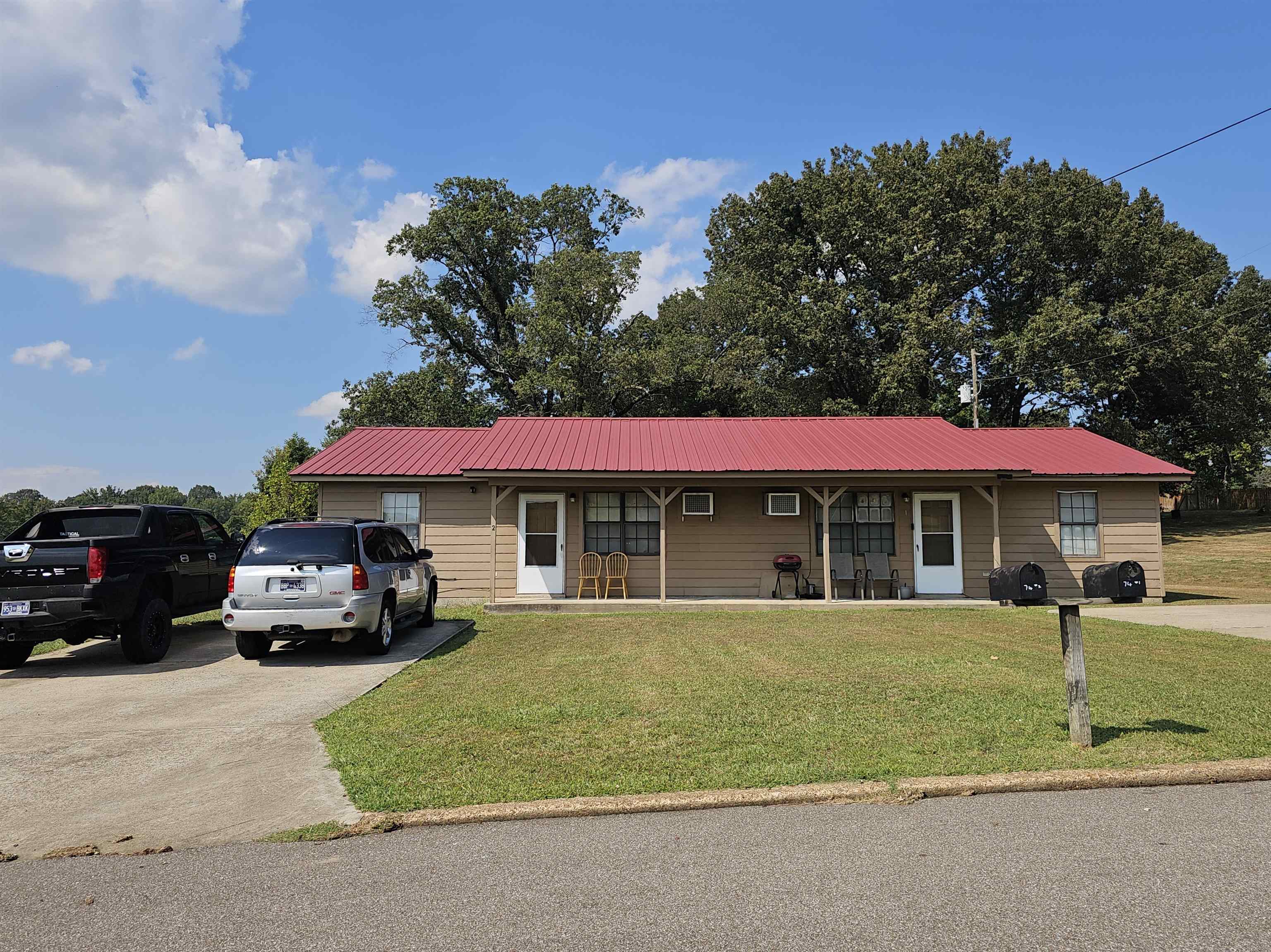 74 Oakhill Subdivision Road Ripley, TN 38063 - Photo 8 of 8 a blue house with outdoor space