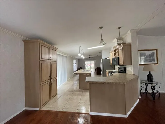 a bathroom with a granite countertop sink and a toilet