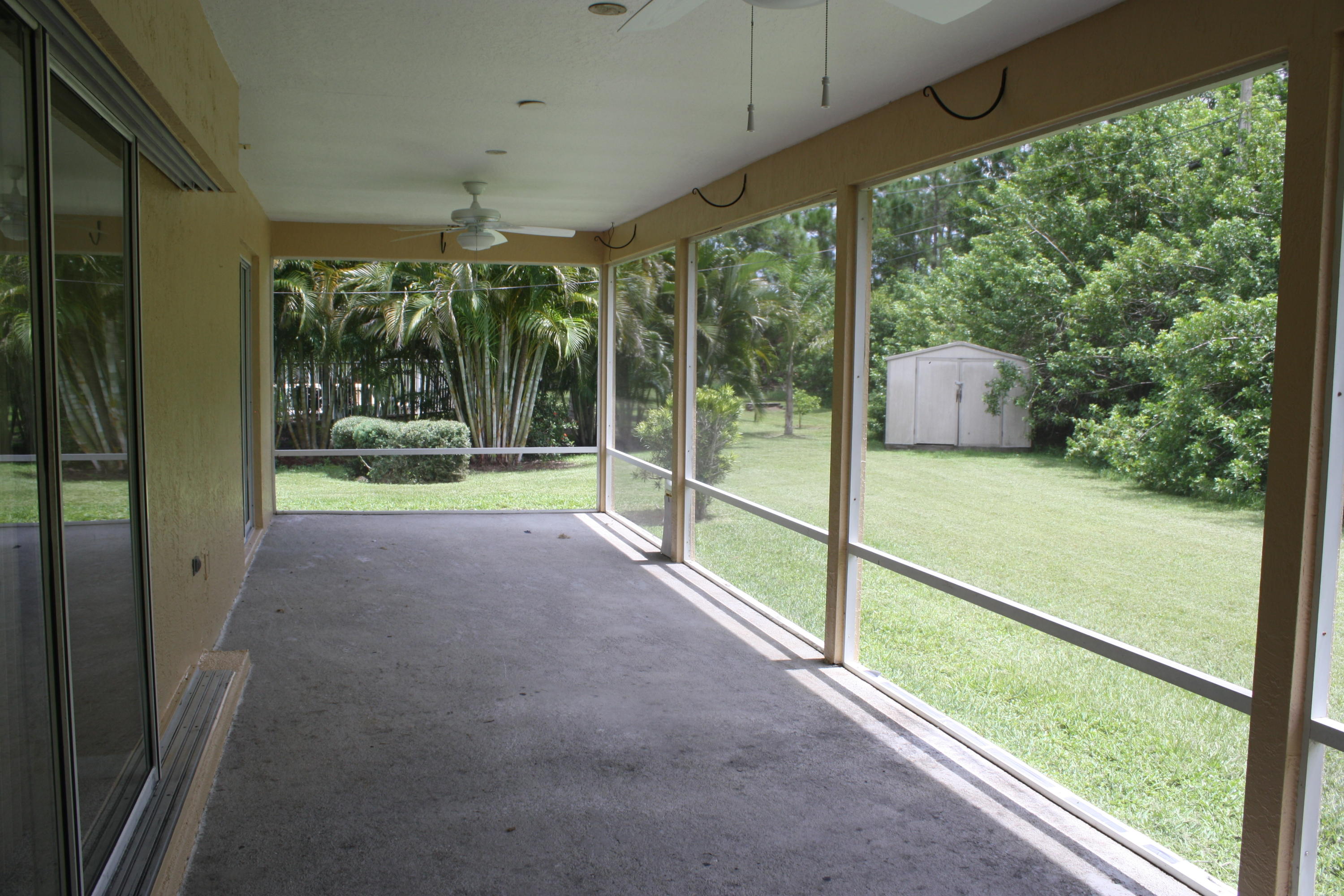 3067 Southeast Wake Road Port St. Lucie, FL 34984 - Photo 20 of 21 Enclosed, Covered Patio