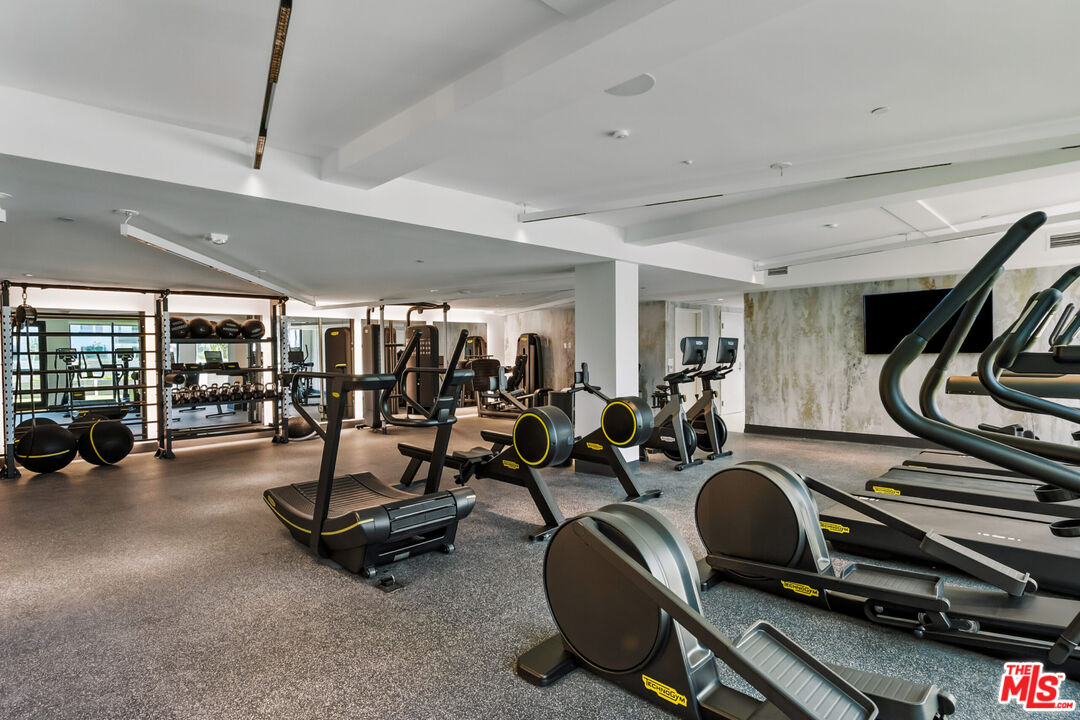 2455 Overland Avenue, Unit 564 Los Angeles, CA 90064 - Photo 12 of 23 a view of a room with gym equipment