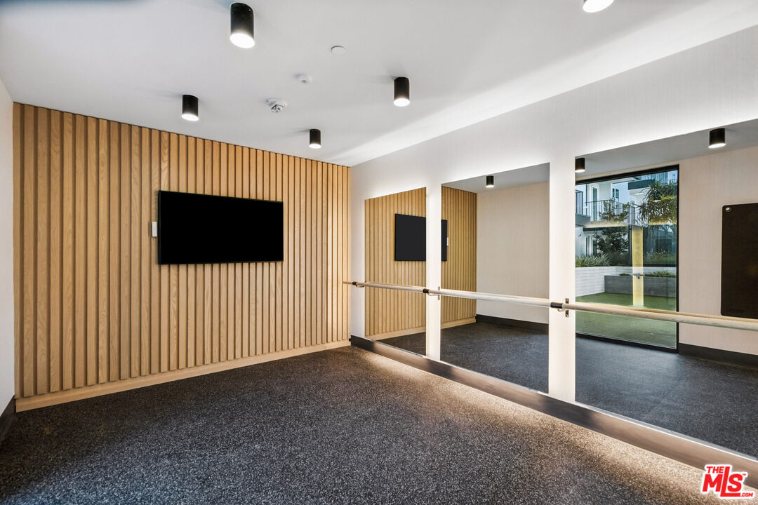 2455 Overland Avenue, Unit 564 Los Angeles, CA 90064 - Photo 14 of 23 wooden floor in an empty room with a window