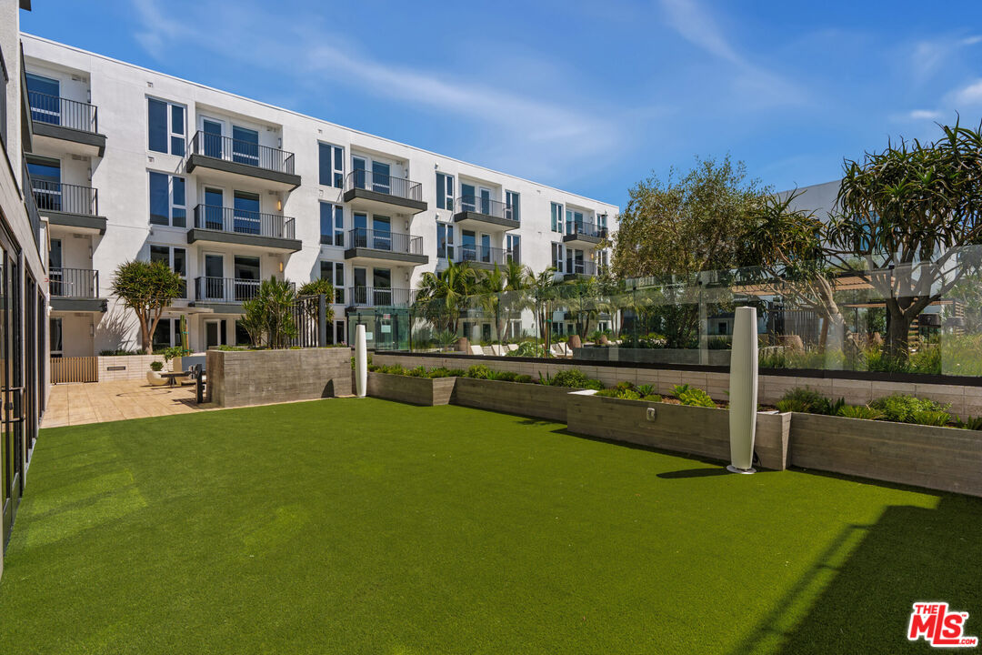 2455 Overland Avenue, Unit 564 Los Angeles, CA 90064 - Photo 15 of 23 a view of swimming pool with outdoor seating and plants