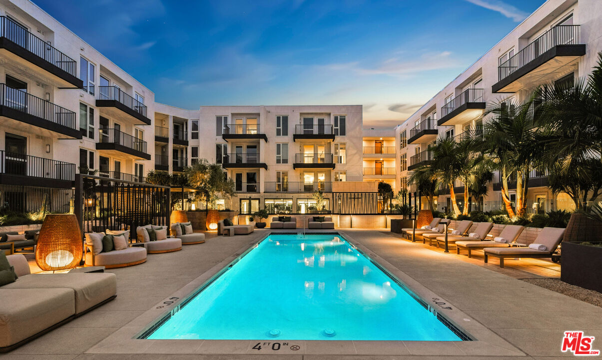 2455 Overland Avenue, Unit 564 Los Angeles, CA 90064 - Photo 6 of 23 a swimming pool with outdoor seating and a patio