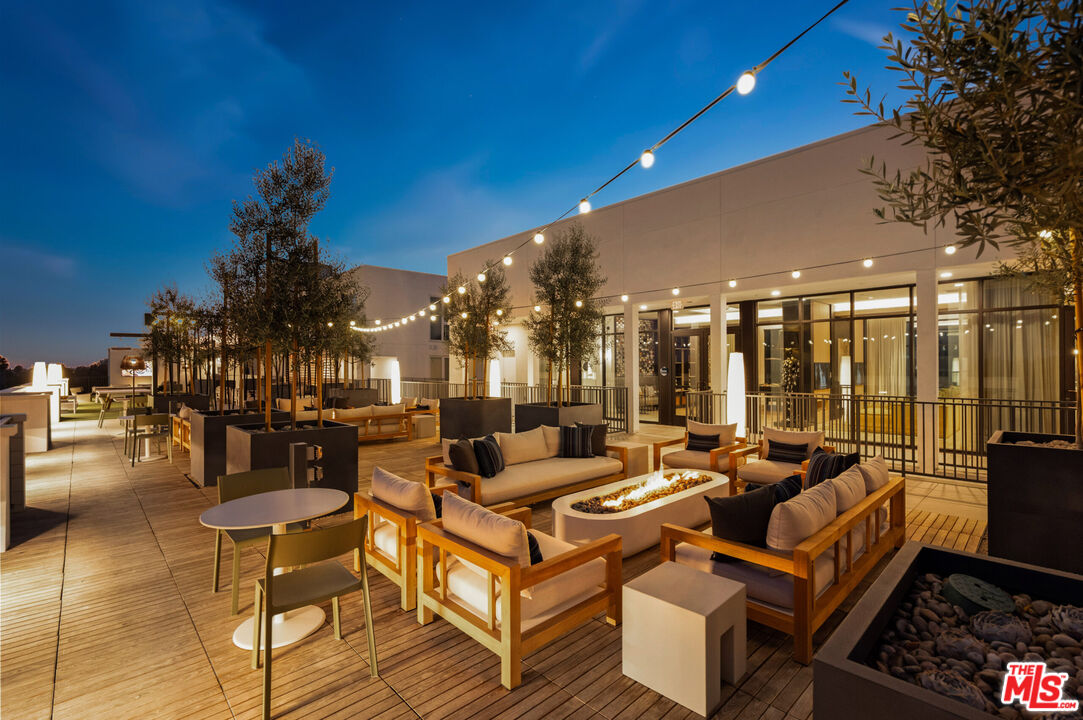 2455 Overland Avenue, Unit 564 Los Angeles, CA 90064 - Photo 7 of 23 a outdoor living space with patio furniture and a potted plant