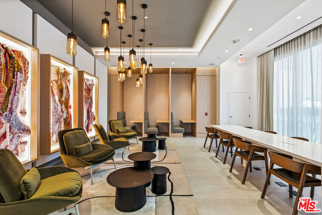 2455 Overland Avenue, Unit 564 Los Angeles, CA 90064 - Photo 10 of 23 a very nice looking living room with furniture and a large window