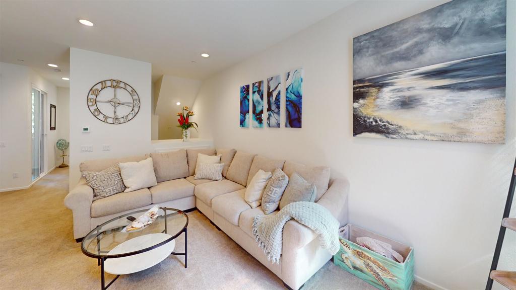 1150 Via Lucero Oceanside, CA 92056 - Photo 9 of 11 a living room with furniture and a large window