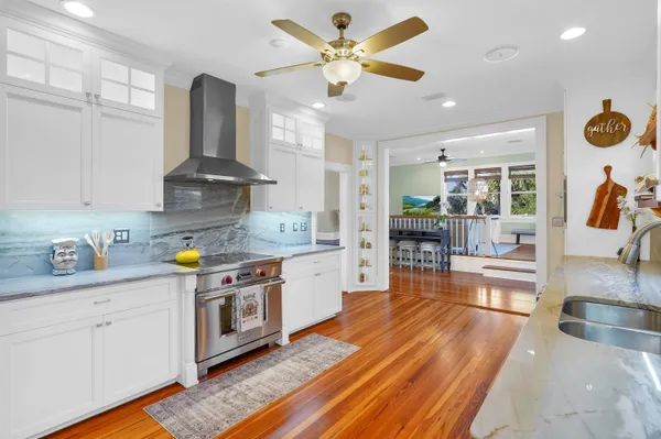 a view of an entryway with wooden floor and door