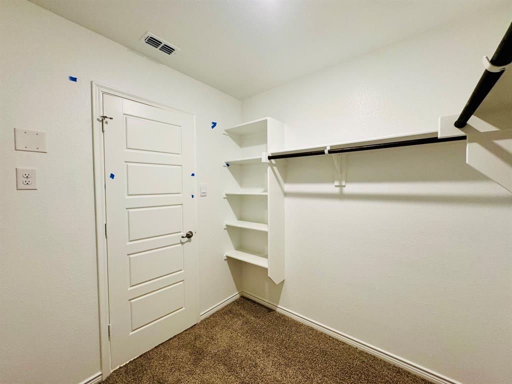 4028 Moss Road Pilot Point, TX 76258 - Photo 10 of 29 a view of an empty walk in closet