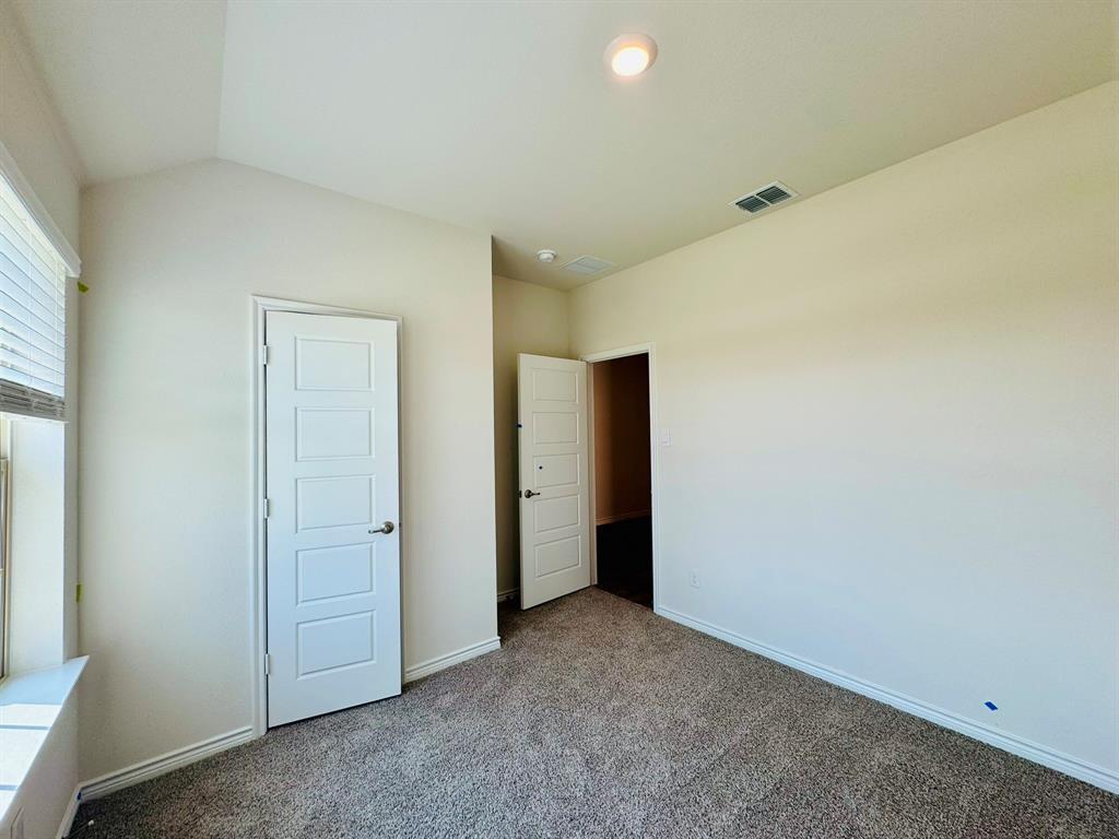 4028 Moss Road Pilot Point, TX 76258 - Photo 20 of 29 an empty room with closet