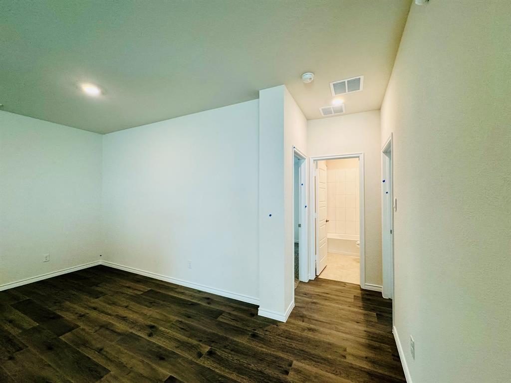 4028 Moss Road Pilot Point, TX 76258 - Photo 21 of 29 a view of a hallway with wooden floor