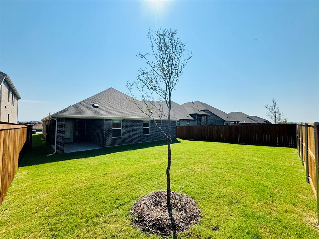 4028 Moss Road Pilot Point, TX 76258 - Photo 24 of 29 a house view with a garden space