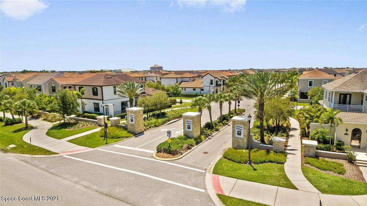 7125 Primavera Lane Melbourne, FL 32940 - Photo 37 of 41 an aerial view of a house with a garden and lake view