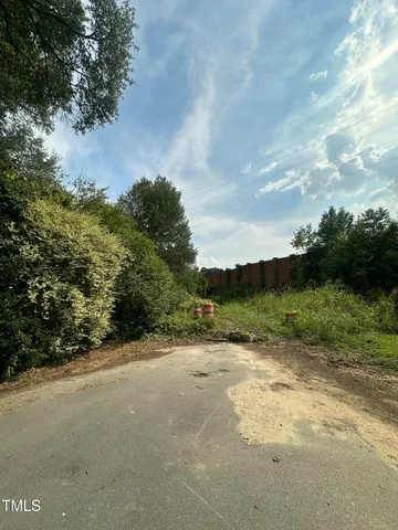 a view of a road with a yard
