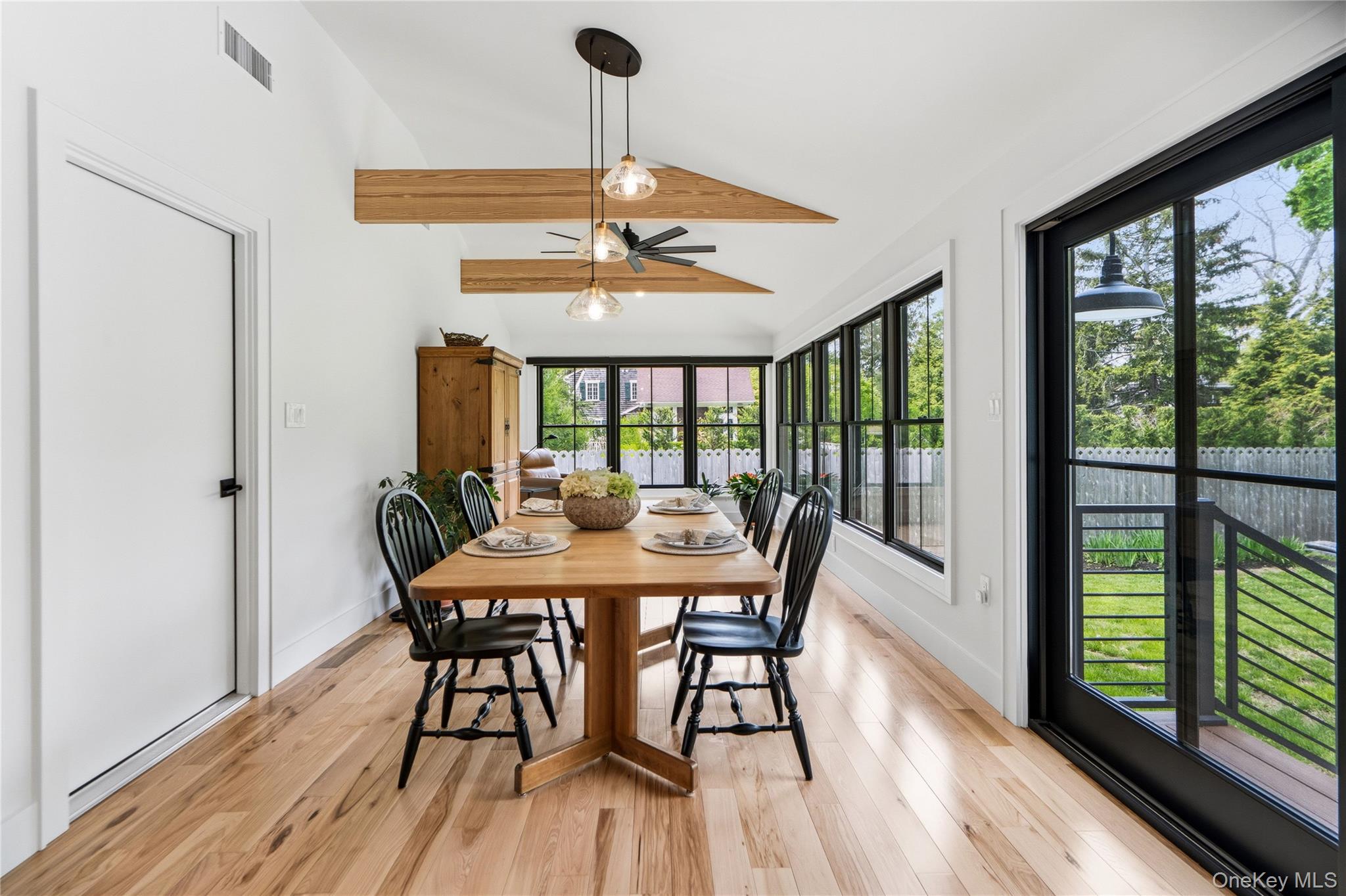 263 Beaver Dam Road Brookhaven, NY 11719 - Photo 13 of 32 a view of a dining room with furniture window and wooden floor