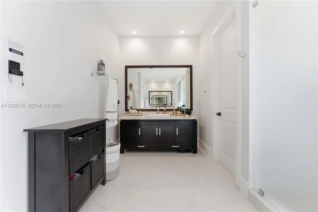 a bathroom with a double vanity sink and a mirror