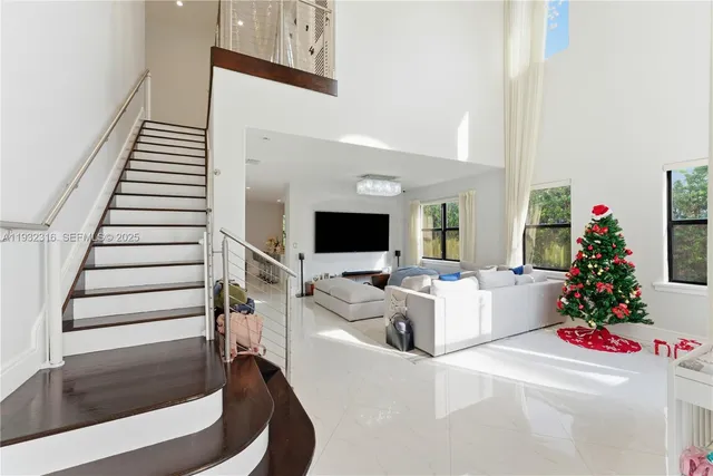 a living room with furniture and flowers