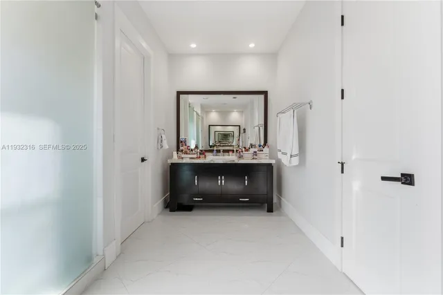 a view of room with a sink and a mirror