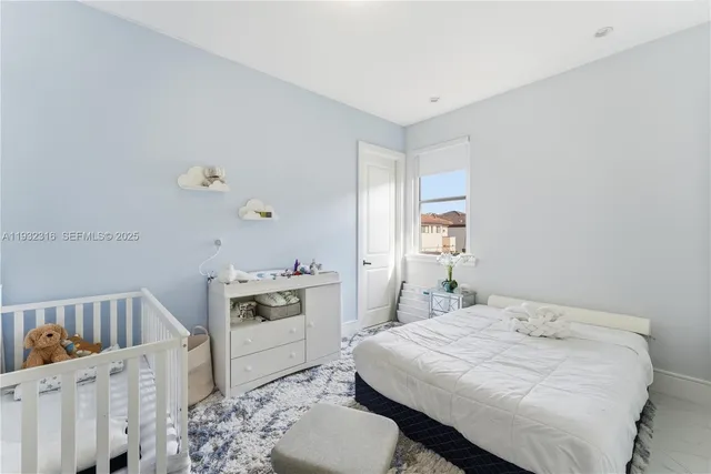 a bedroom with a bed and a cabinets