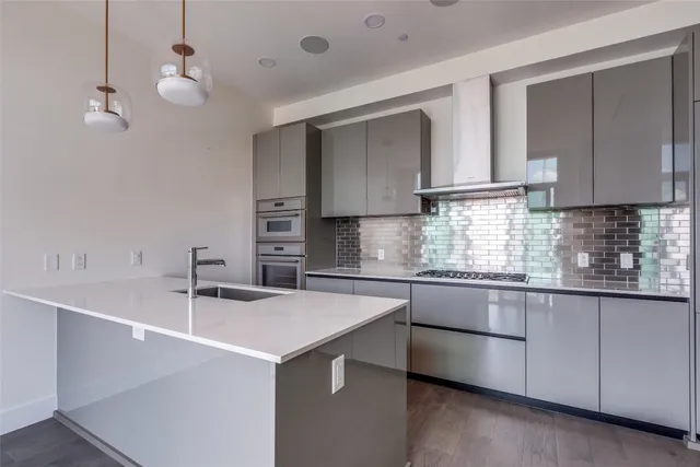 a kitchen with a sink cabinets and window