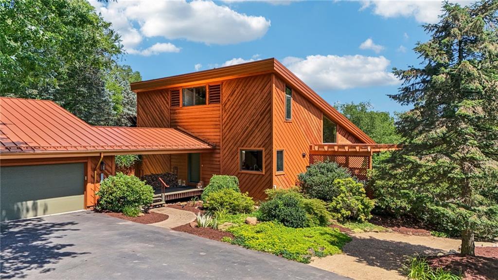 8110 Ridge Road Natrona Heights, PA 15065 - Photo 1 of 50 a backyard of a house with wooden fence and plants