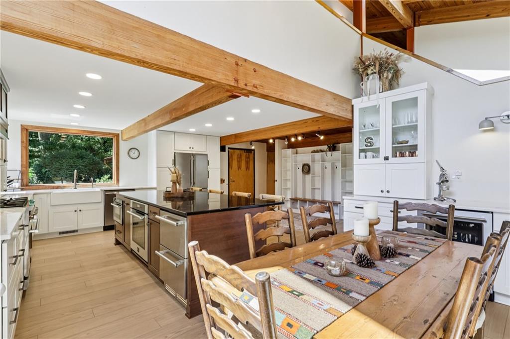 8110 Ridge Road Natrona Heights, PA 15065 - Photo 11 of 50 a kitchen with stainless steel appliances granite countertop sink stove and wooden cabinets