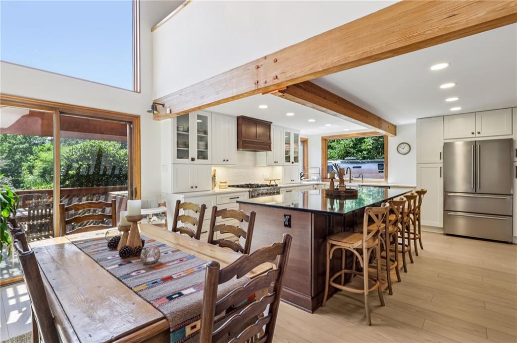 8110 Ridge Road Natrona Heights, PA 15065 - Photo 12 of 50 a dining room with furniture a chandelier and wooden floor