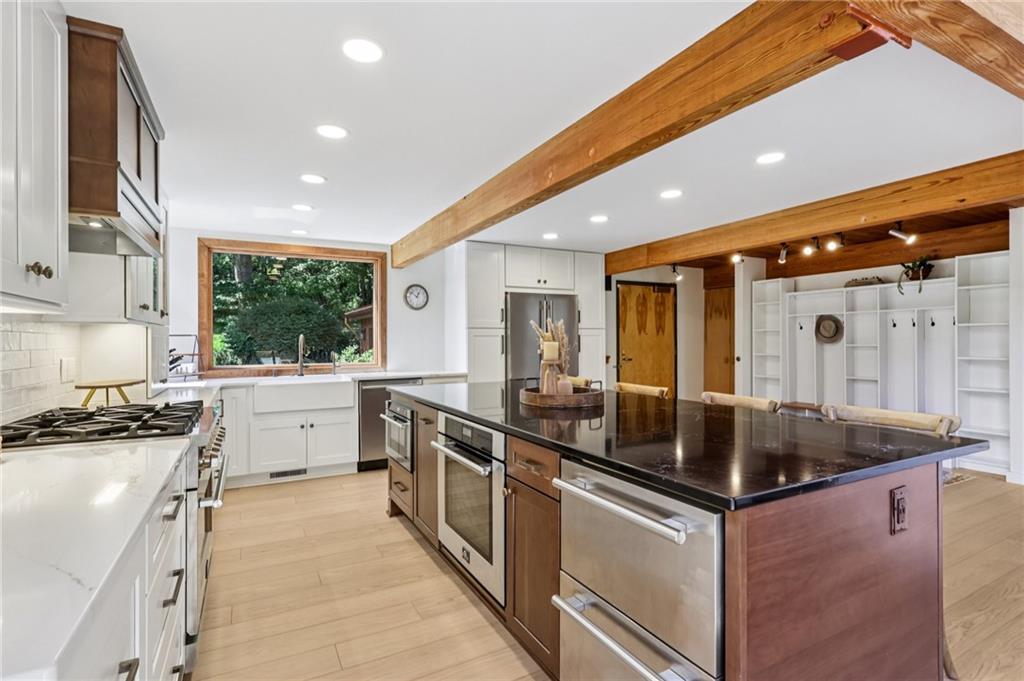 8110 Ridge Road Natrona Heights, PA 15065 - Photo 15 of 50 a kitchen with stainless steel appliances granite countertop a sink and stove