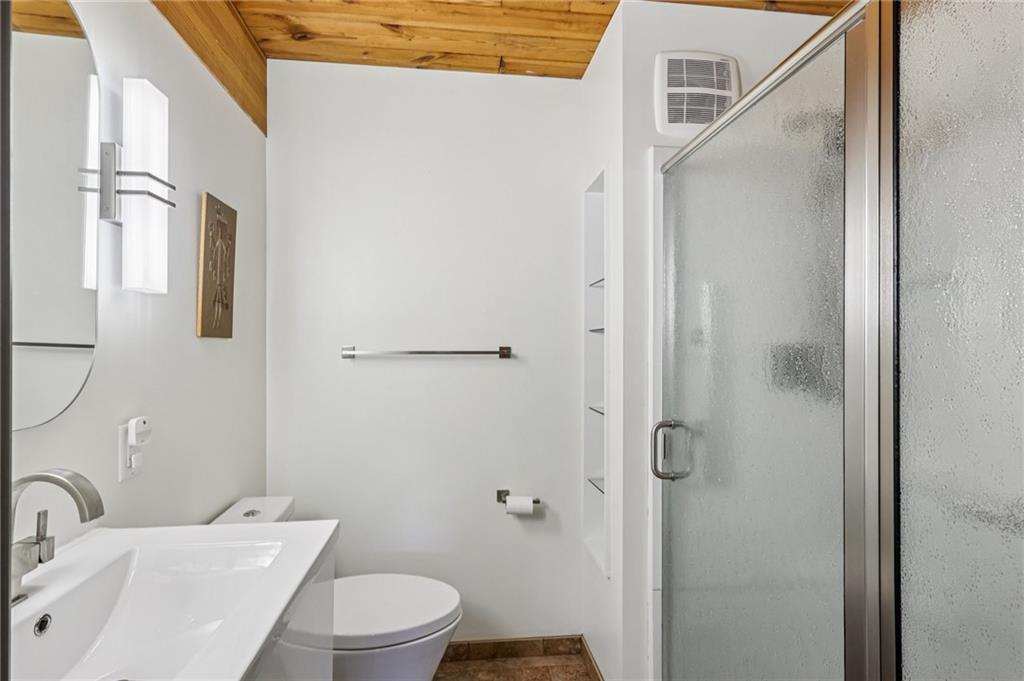 8110 Ridge Road Natrona Heights, PA 15065 - Photo 18 of 50 a bathroom with a toilet sink and shower