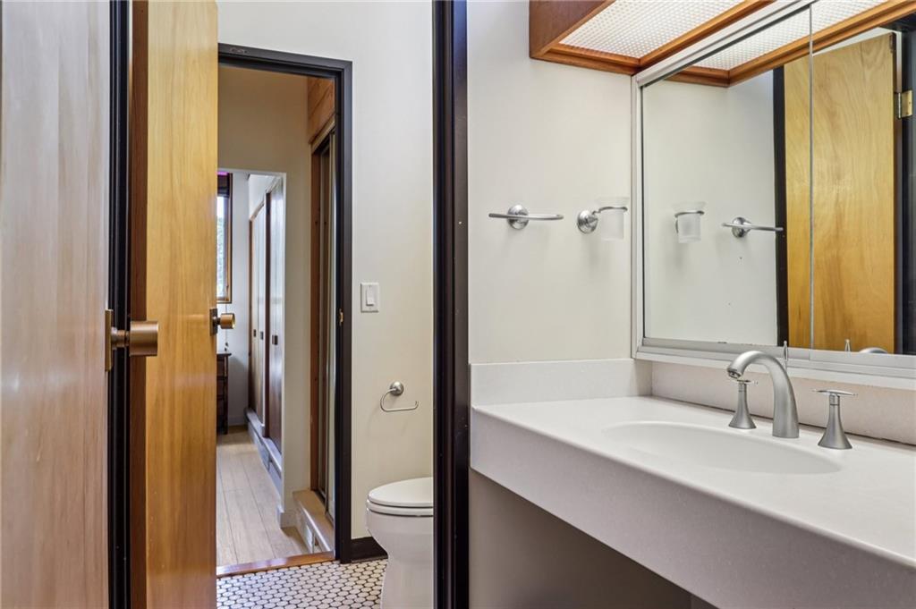 8110 Ridge Road Natrona Heights, PA 15065 - Photo 27 of 50 a bathroom with a sink and a mirror