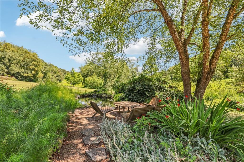 8110 Ridge Road Natrona Heights, PA 15065 - Photo 36 of 50 a backyard of a house with lots of green space and fountain