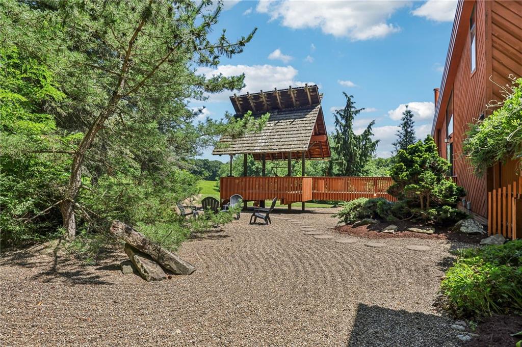 8110 Ridge Road Natrona Heights, PA 15065 - Photo 40 of 50 an outdoor space with seating area and trees