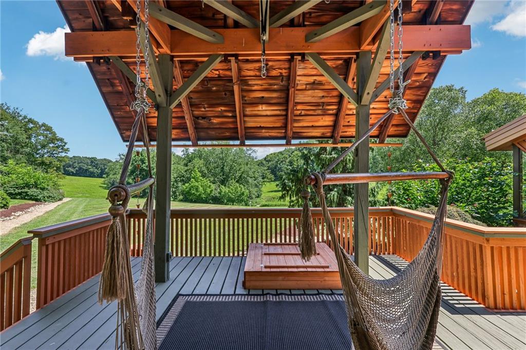 8110 Ridge Road Natrona Heights, PA 15065 - Photo 41 of 50 a view of a roof deck with chair and wooden floor